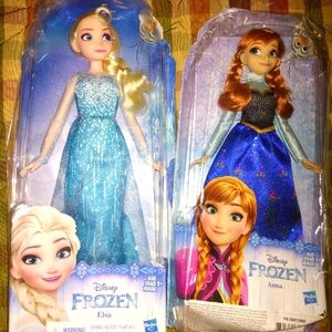 Elsa and Anna Barbie dolls